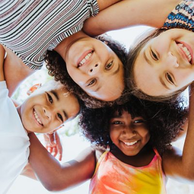 Group of children smiling and looking at the camera